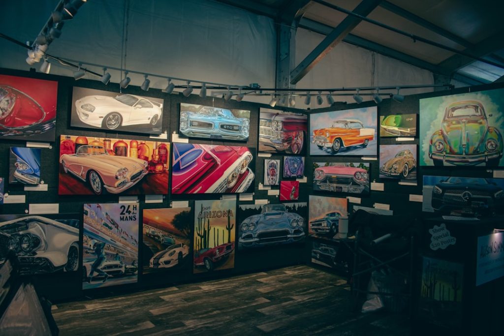 collection-of-car-art-displayed-on-a-wall-hyj4l17ubdg